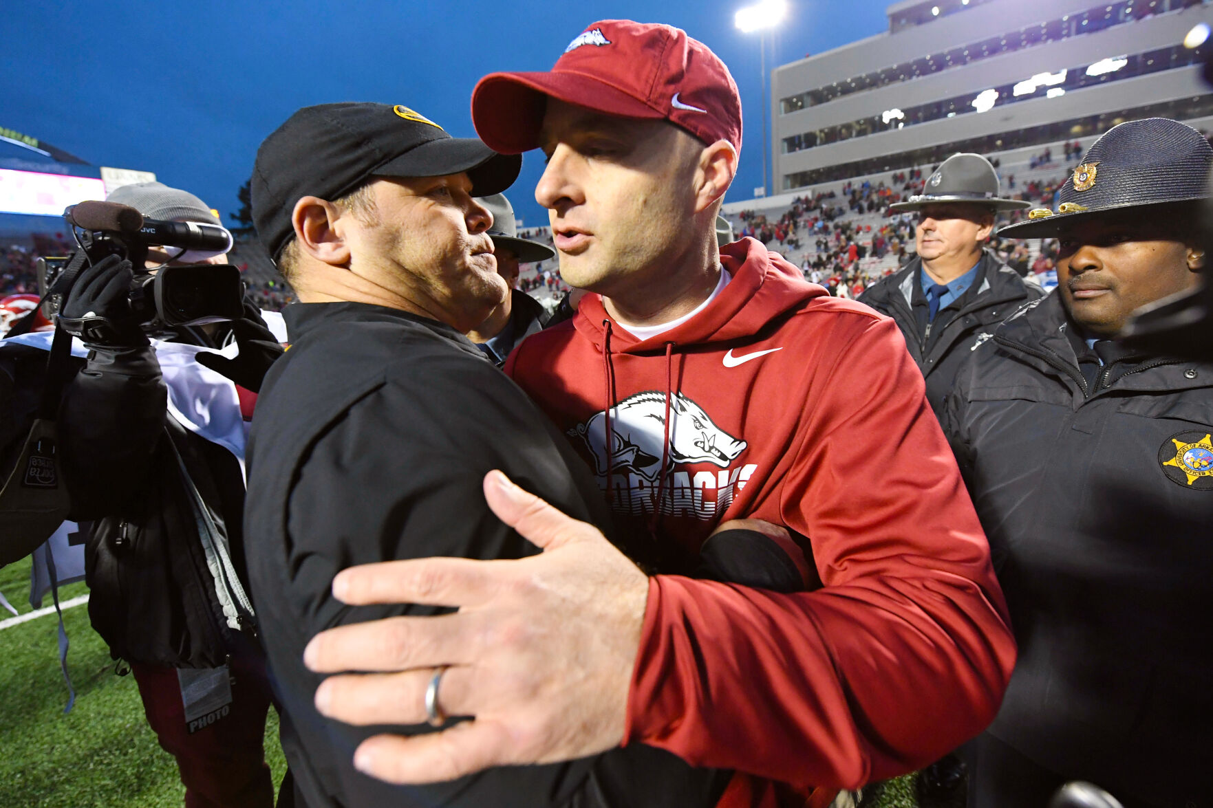 Barry Odom hugs Arkansas interim head coach